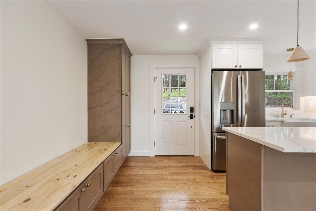 50 Pine Grove Road Lunenburg, MA 01462 - Photo 9 of 42 a view of a kitchen with a sink and refrigerator