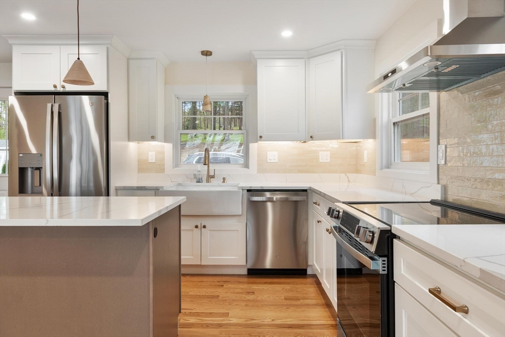 50 Pine Grove Road Lunenburg, MA 01462 - Photo 10 of 42 a kitchen with stainless steel appliances granite countertop a sink stove and refrigerator