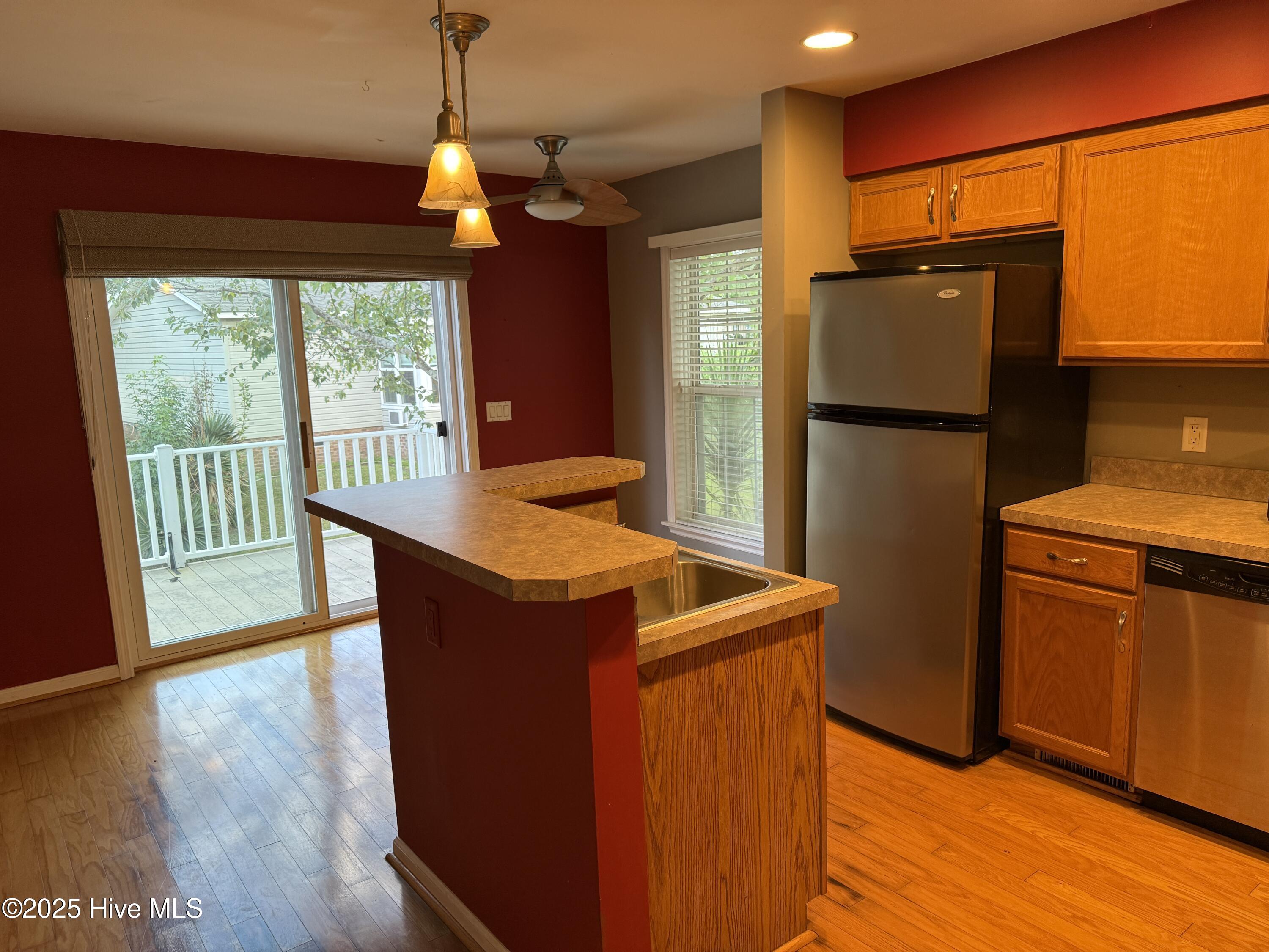 1094 Clubview Lane Southwest Calabash, NC 28467 - Photo 6 of 14 Kitchen Island and sliding door to back yard