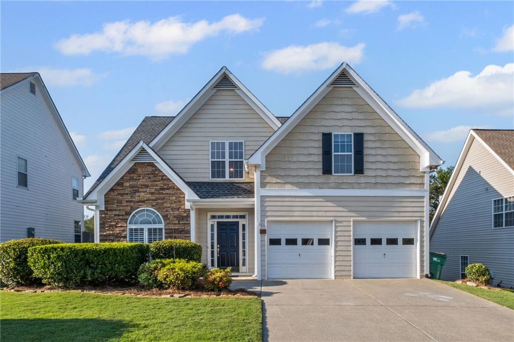 205 Towne Ridge Drive Woodstock, GA 30188 - Photo 1 of 1 a view of a yard in front of house