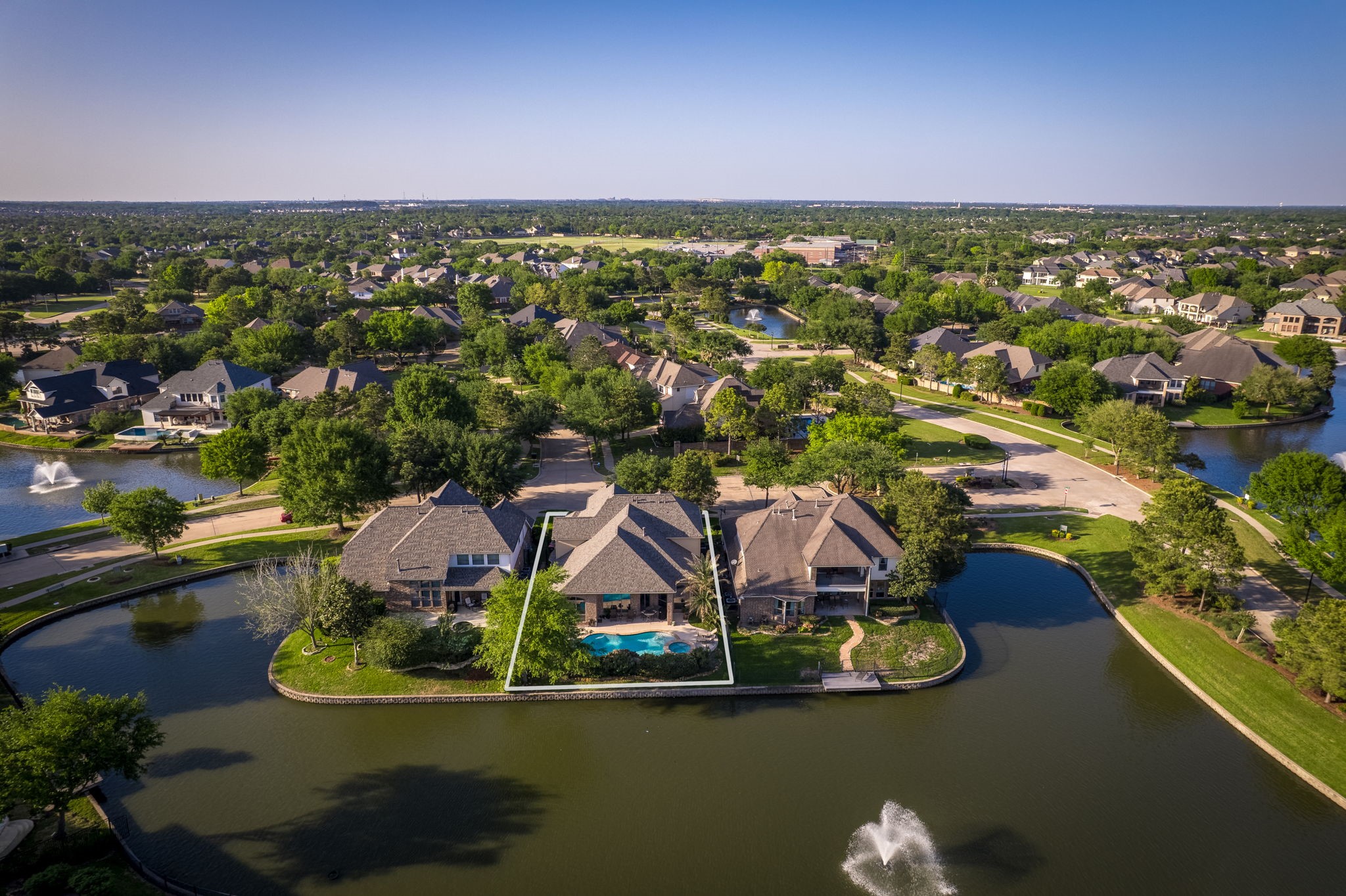 an aerial view of a house with a lake view