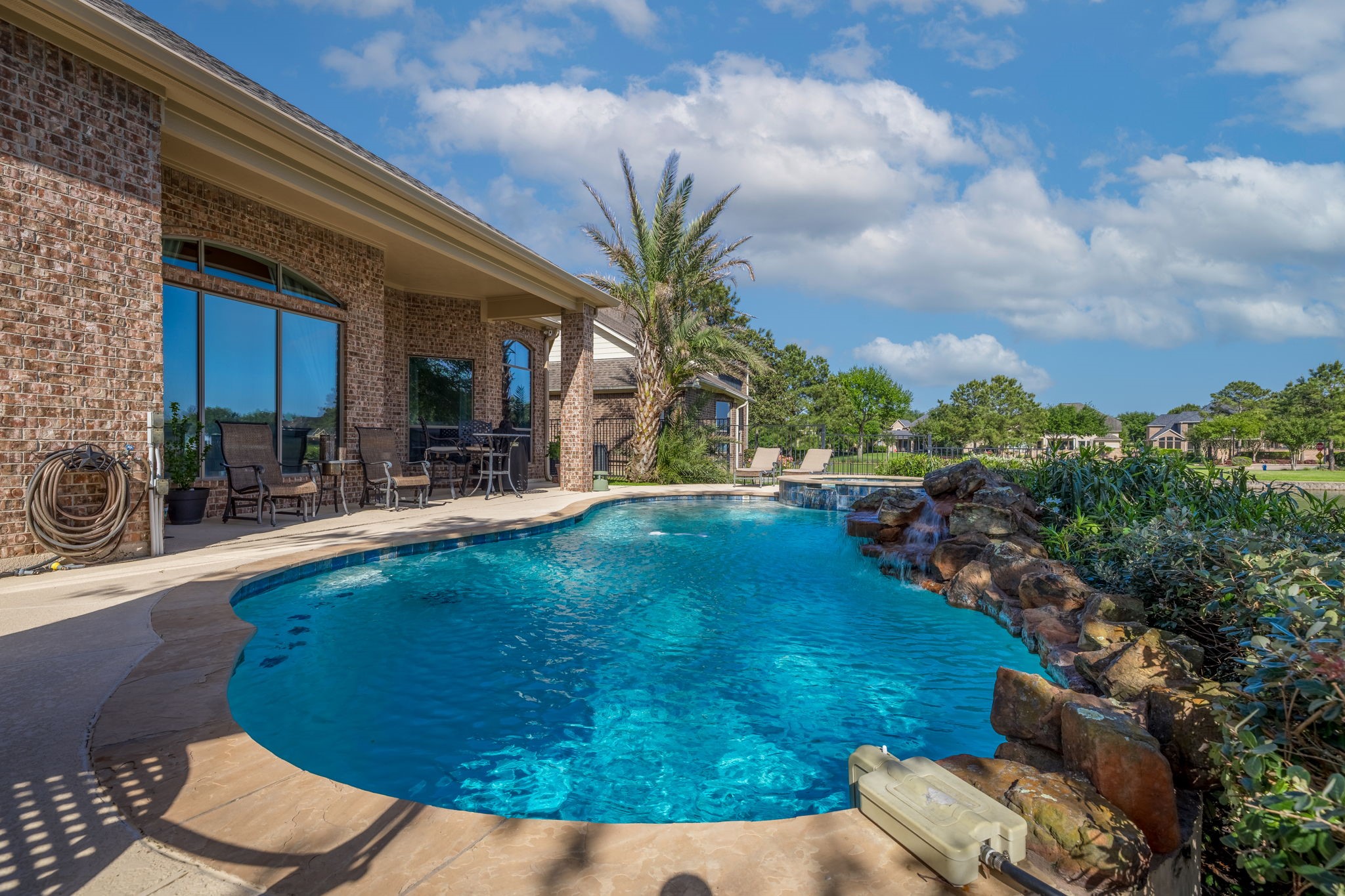 8411 Middle Canyon Road Katy, TX 77494 - Photo 11 of 49 a view of a swimming pool with a patio