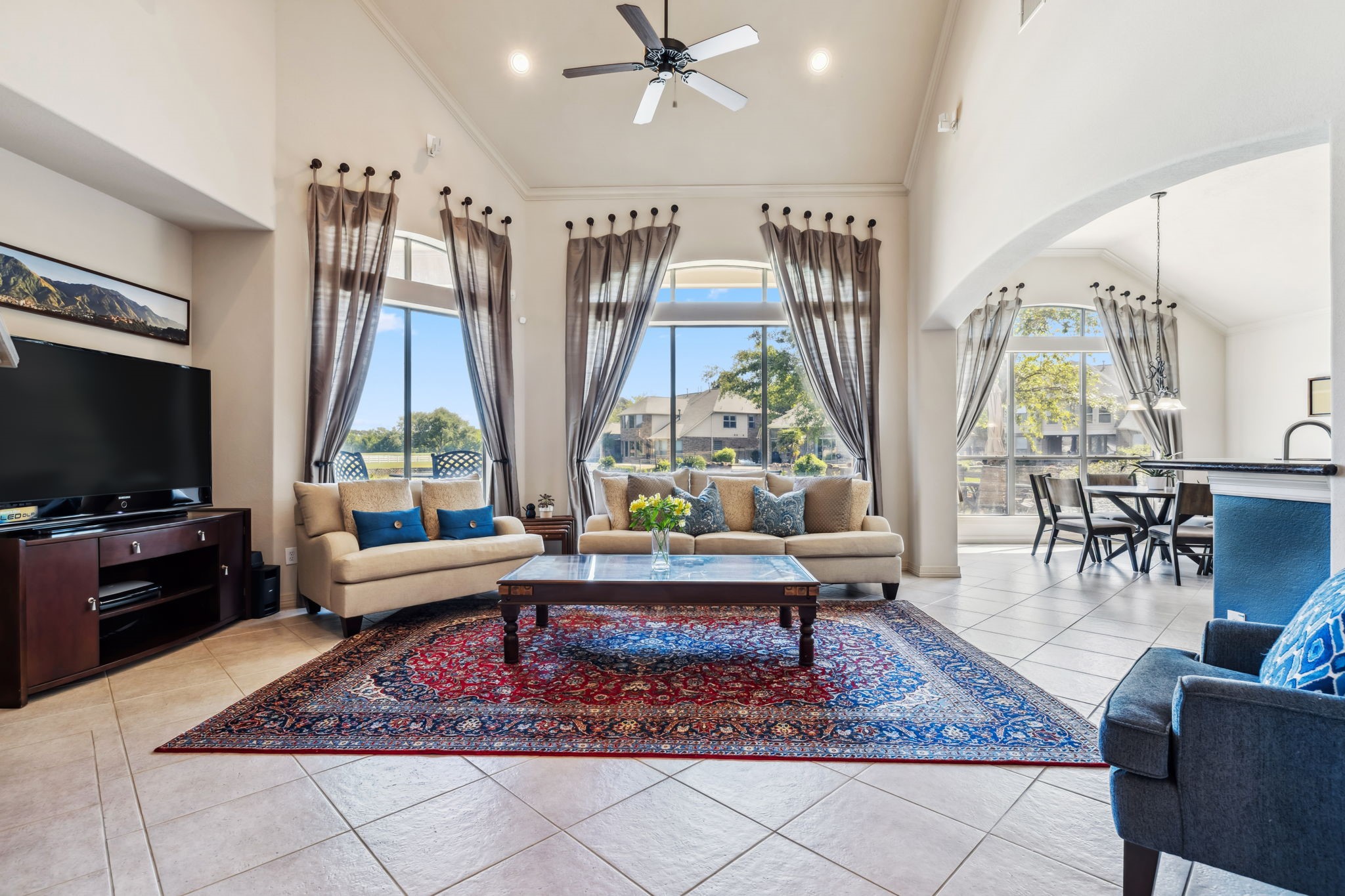 8411 Middle Canyon Road Katy, TX 77494 - Photo 17 of 49 a living room with fireplace furniture and a flat screen tv