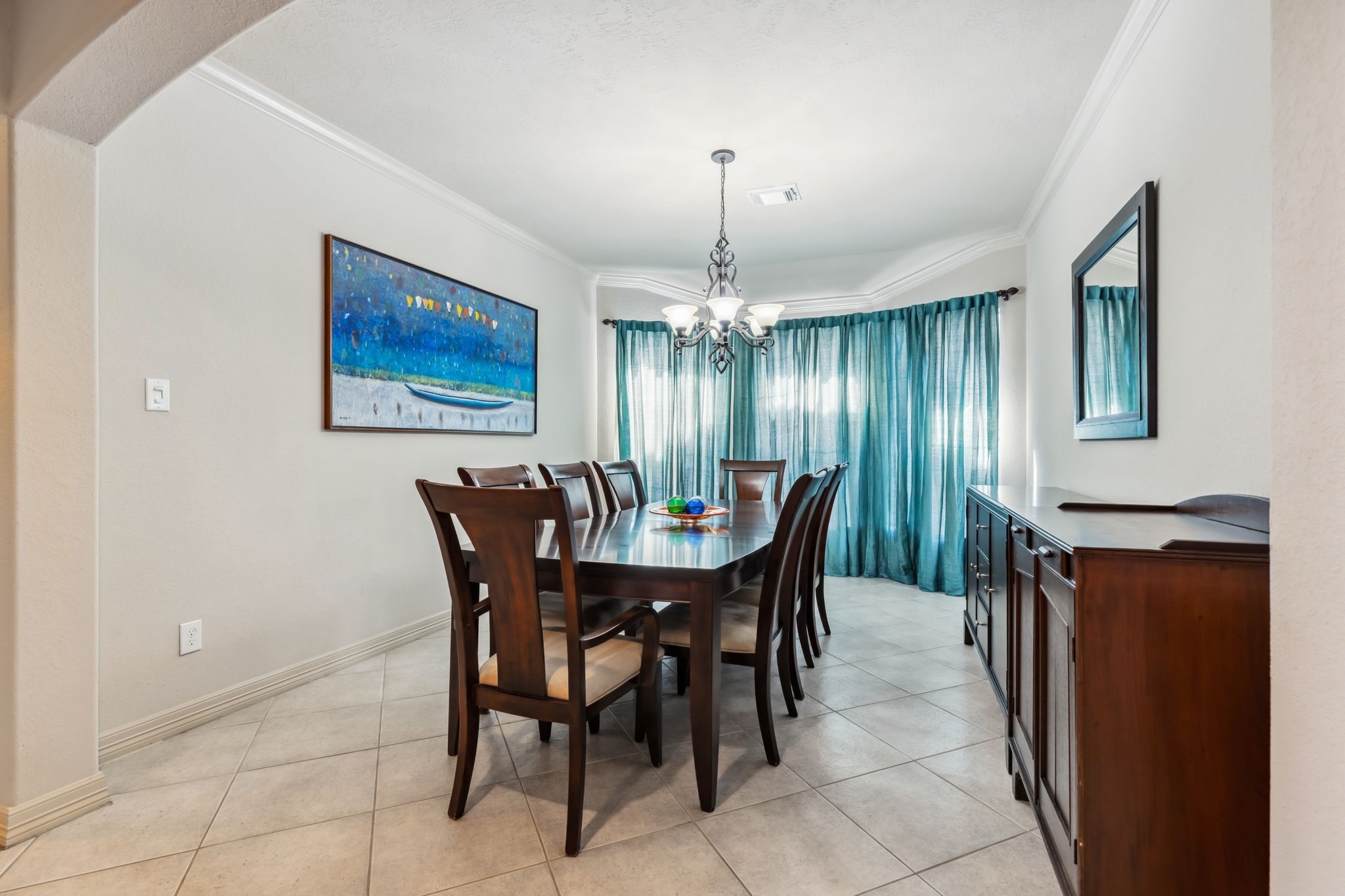 8411 Middle Canyon Road Katy, TX 77494 - Photo 21 of 49 a view of a dining room with furniture and chandelier
