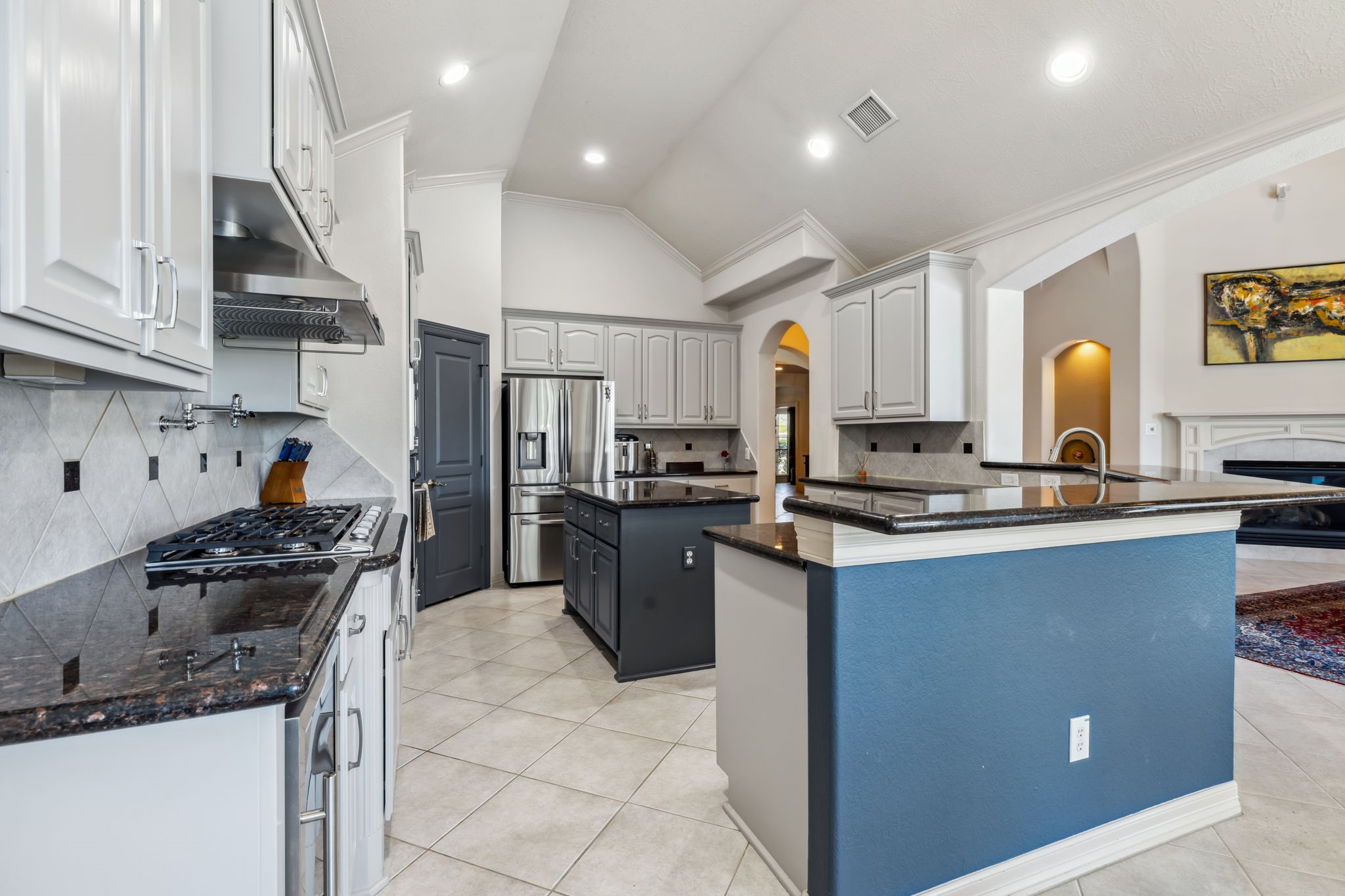 8411 Middle Canyon Road Katy, TX 77494 - Photo 24 of 49 a kitchen with stainless steel appliances granite countertop a sink stove and refrigerator