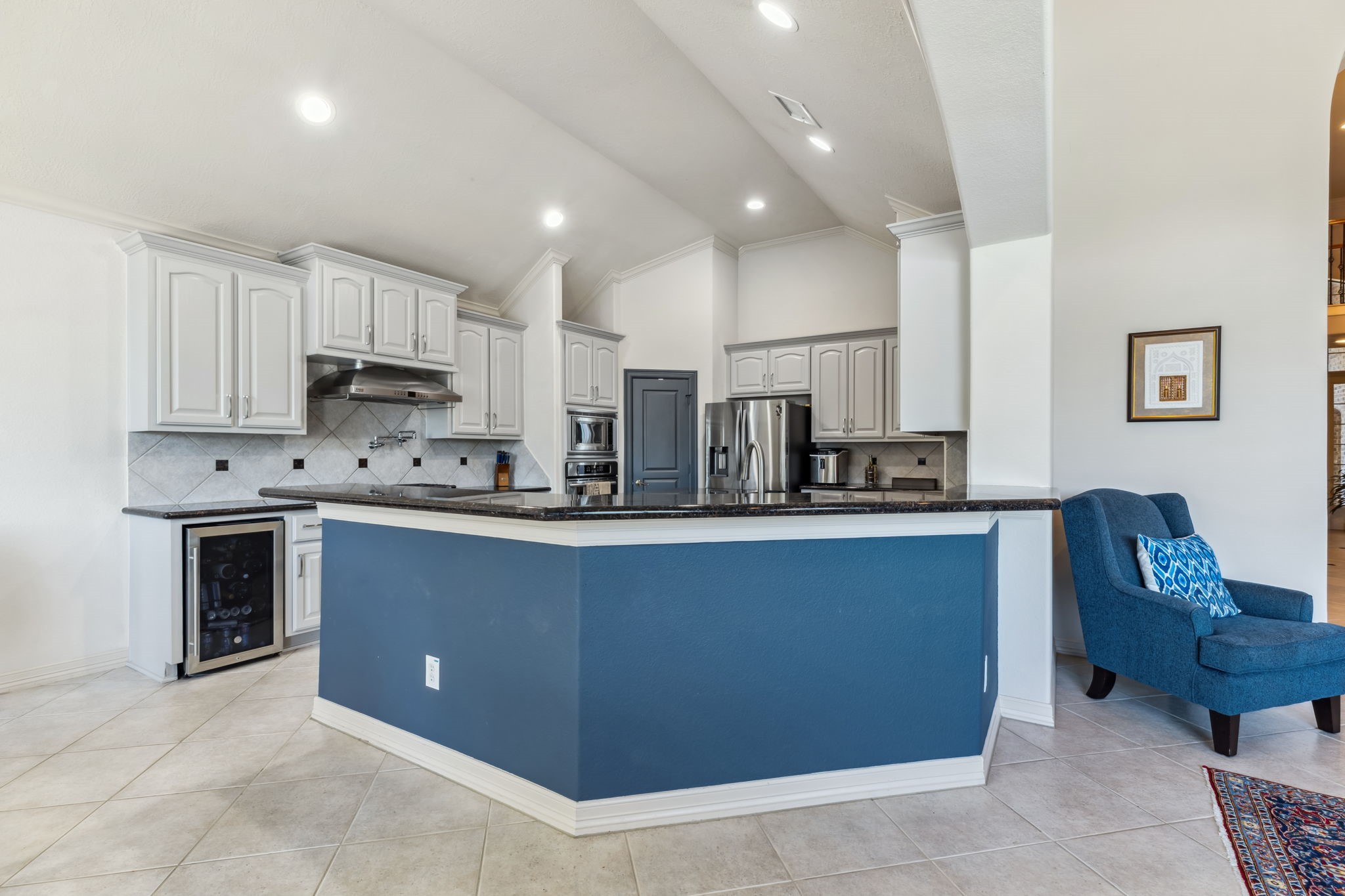 8411 Middle Canyon Road Katy, TX 77494 - Photo 27 of 49 a kitchen with stainless steel appliances a stove a sink a refrigerator and cabinets