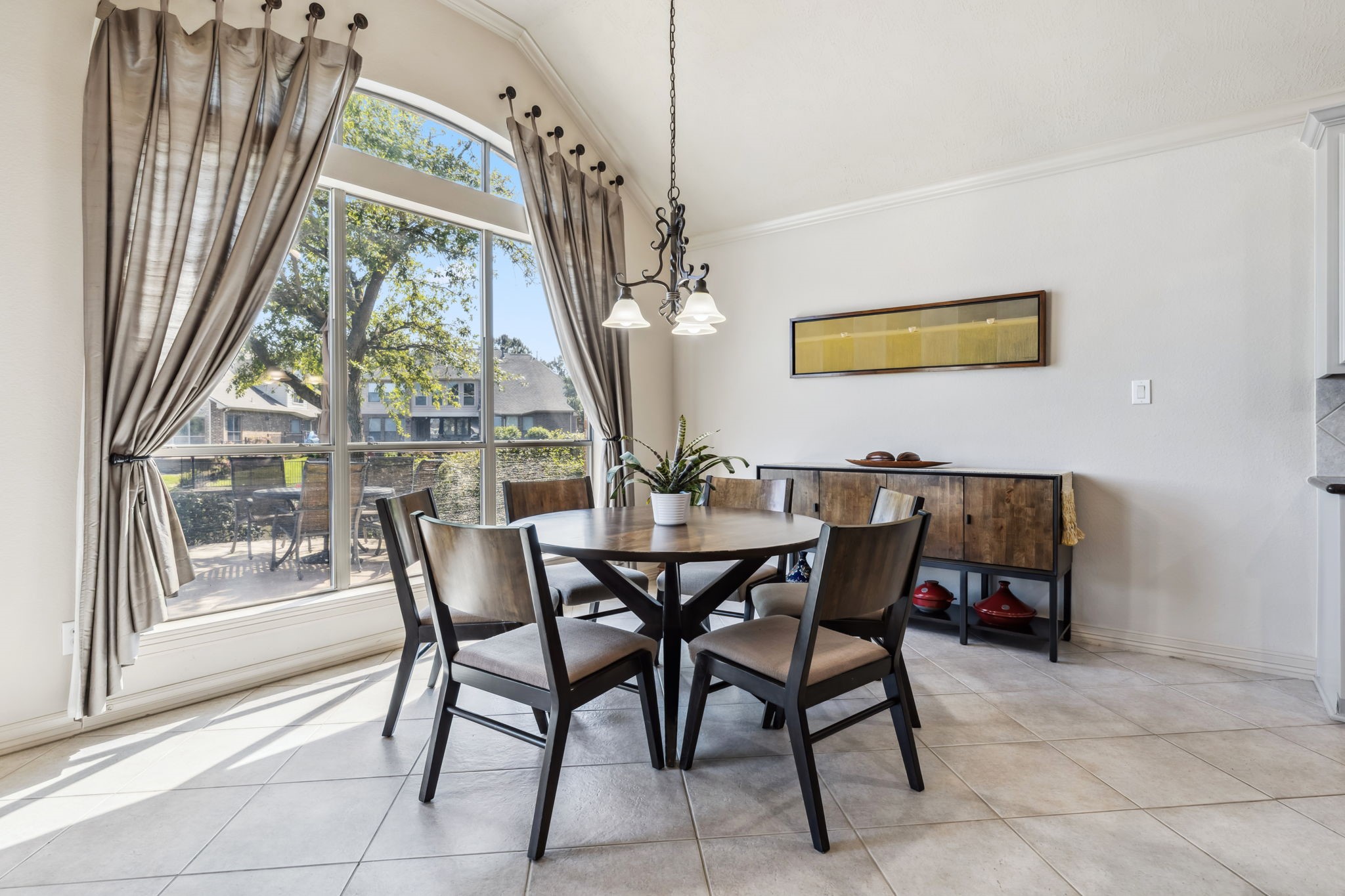 8411 Middle Canyon Road Katy, TX 77494 - Photo 28 of 49 a view of a dining room with furniture wooden floor and a chandelier