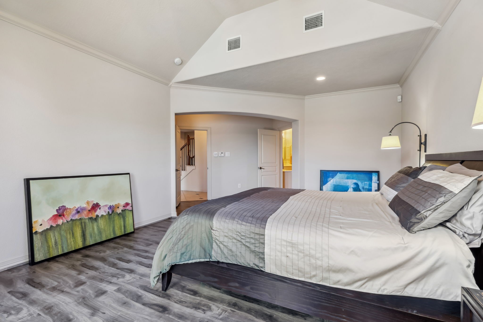 8411 Middle Canyon Road Katy, TX 77494 - Photo 32 of 49 a bedroom with a bed and painting on the wall