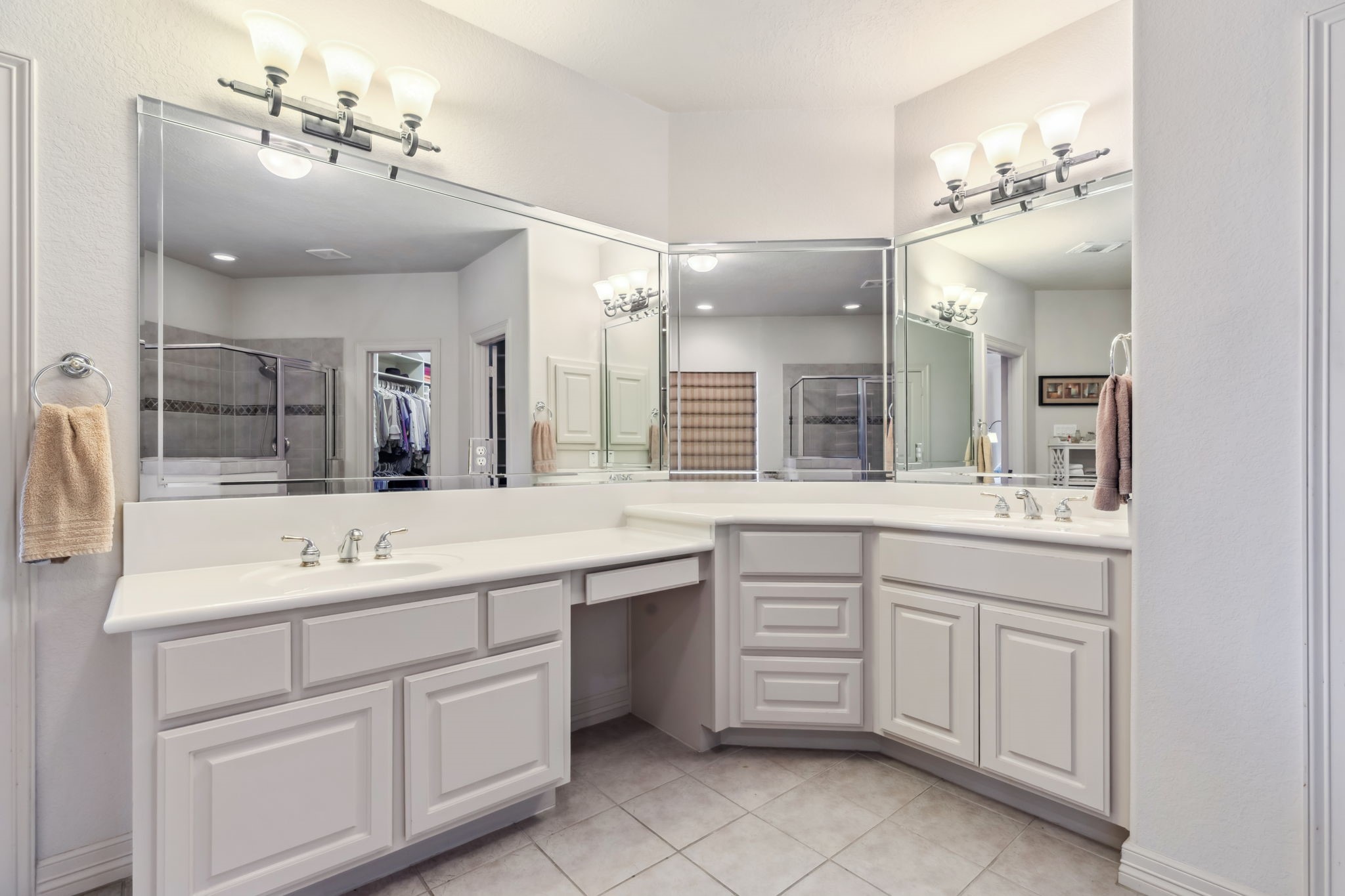 8411 Middle Canyon Road Katy, TX 77494 - Photo 34 of 49 a spacious bathroom with a granite countertop sink a large mirror and vanity