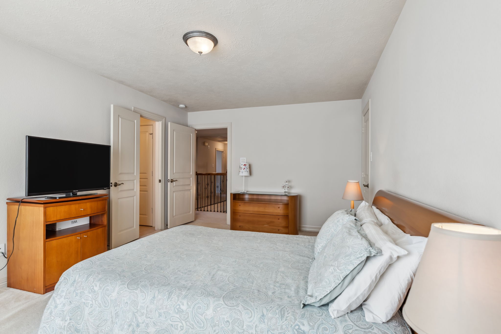 8411 Middle Canyon Road Katy, TX 77494 - Photo 40 of 49 a bedroom with a bed and a flat screen tv