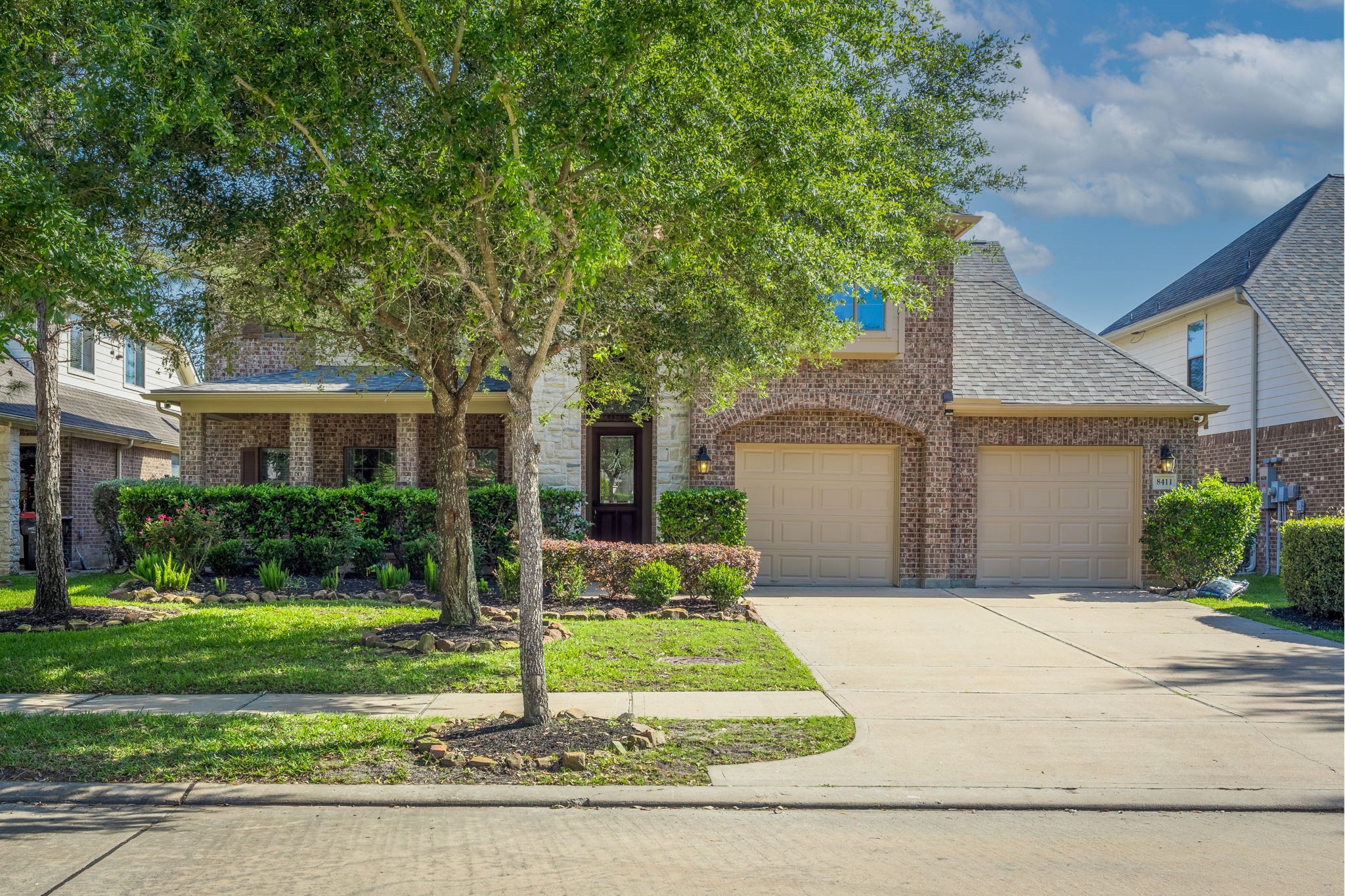 8411 Middle Canyon Road Katy, TX 77494 - Photo 4 of 49 a front view of a house with a yard and garage
