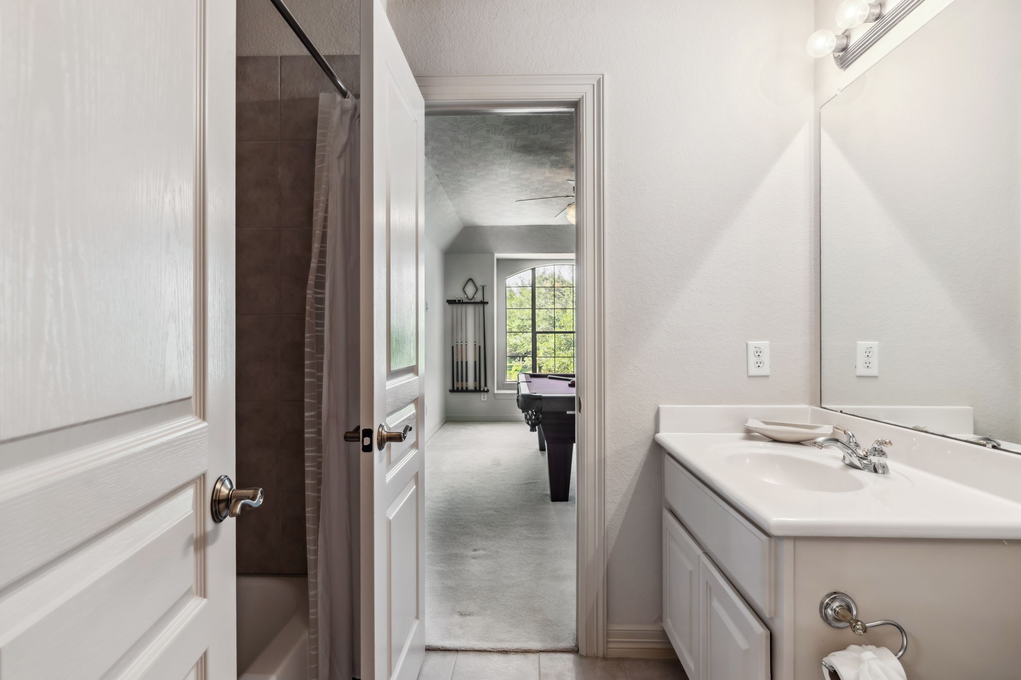 8411 Middle Canyon Road Katy, TX 77494 - Photo 41 of 49 a en suite bathroom with a sink a mirror and a shower