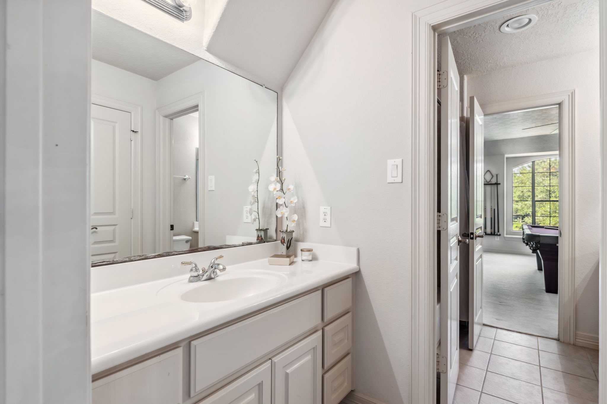 8411 Middle Canyon Road Katy, TX 77494 - Photo 42 of 49 a bathroom with a sink and a mirror
