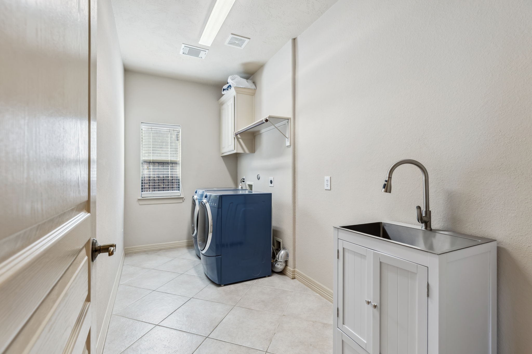 8411 Middle Canyon Road Katy, TX 77494 - Photo 49 of 49 a kitchen with a refrigerator and window