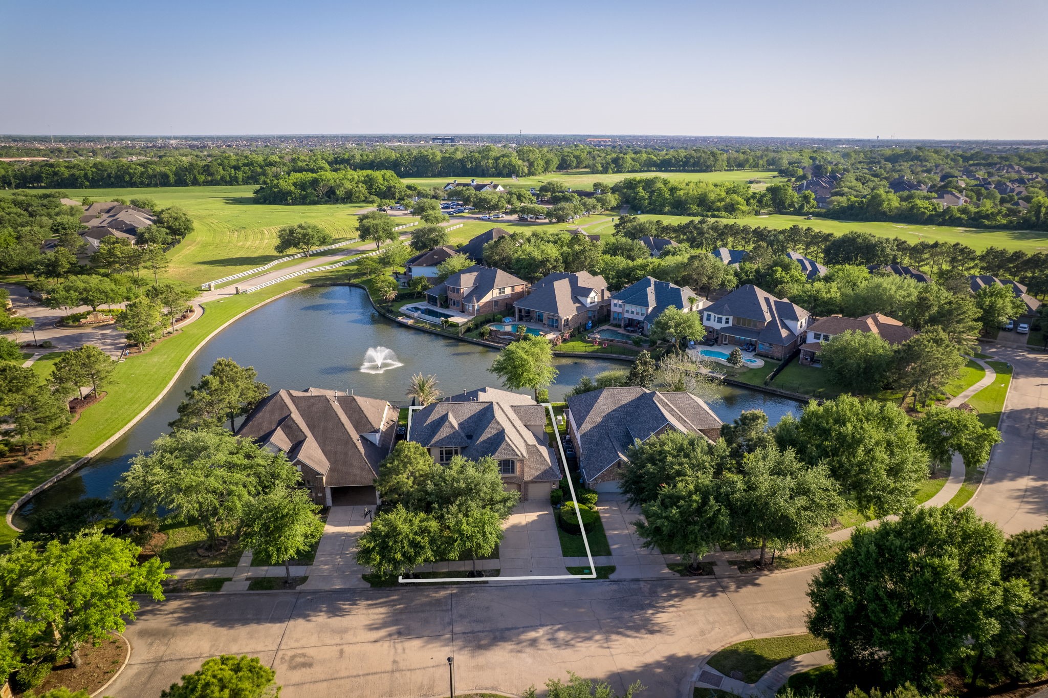 8411 Middle Canyon Road Katy, TX 77494 - Photo 6 of 49 an aerial view of a house with a lake view