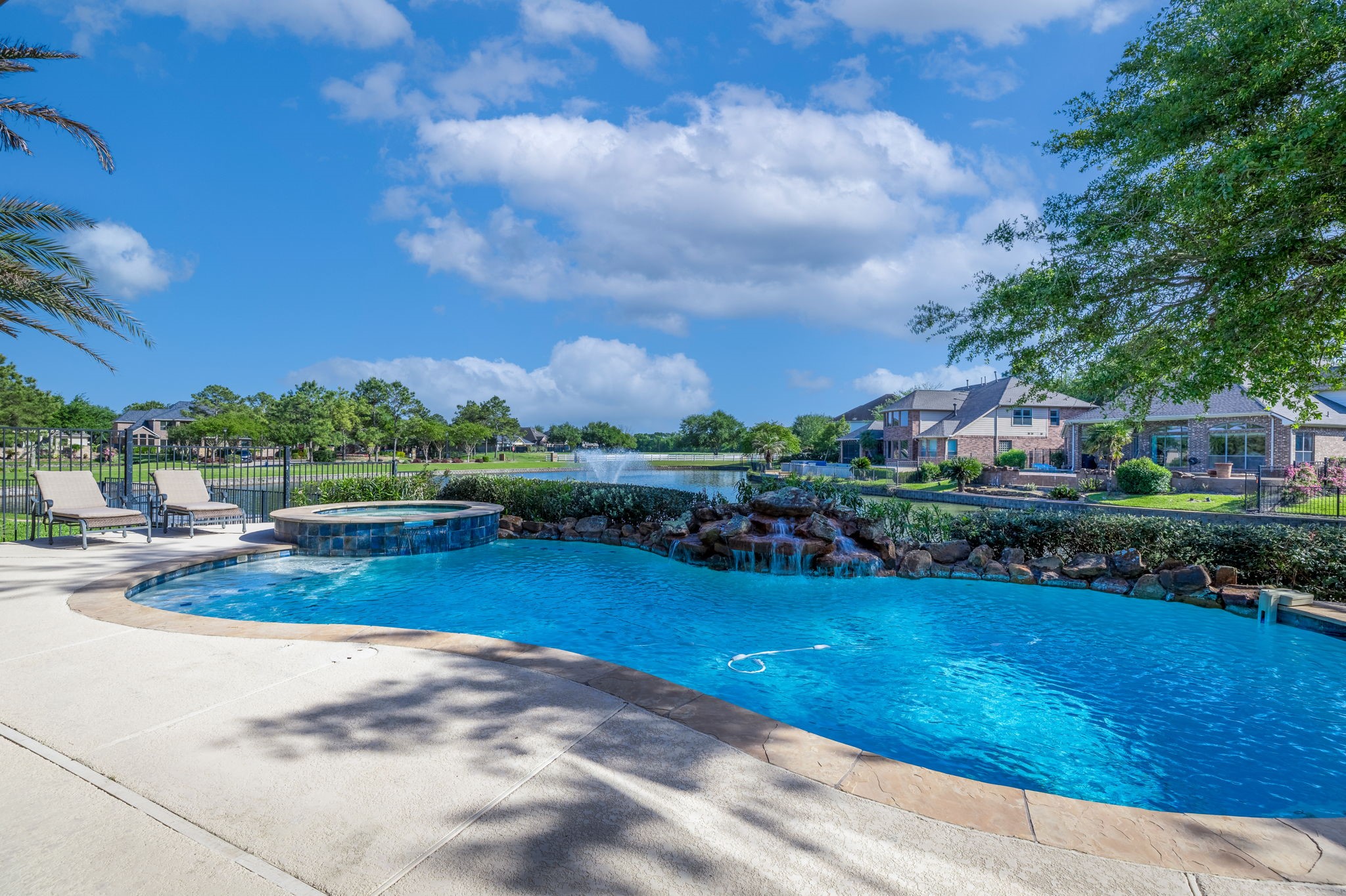 8411 Middle Canyon Road Katy, TX 77494 - Photo 9 of 49 a view of a swimming pool and outdoor seating