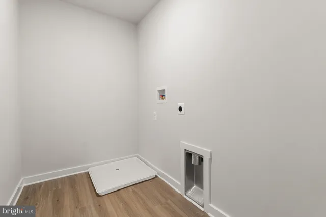 a spacious bathroom with a shower and a sink