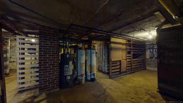 a view of walk in closet with clothes