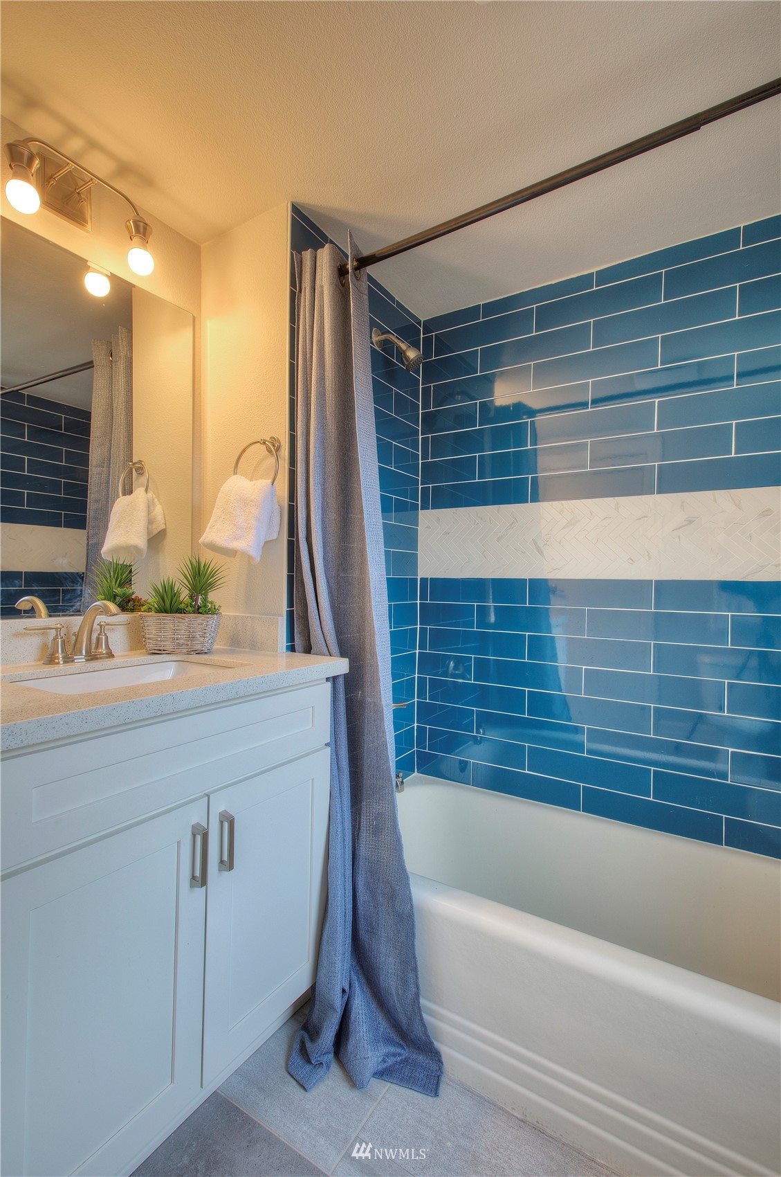 12222 Military Road South Seattle, WA 98168 - Photo 11 of 33 a bathroom with a bathtub and a sink