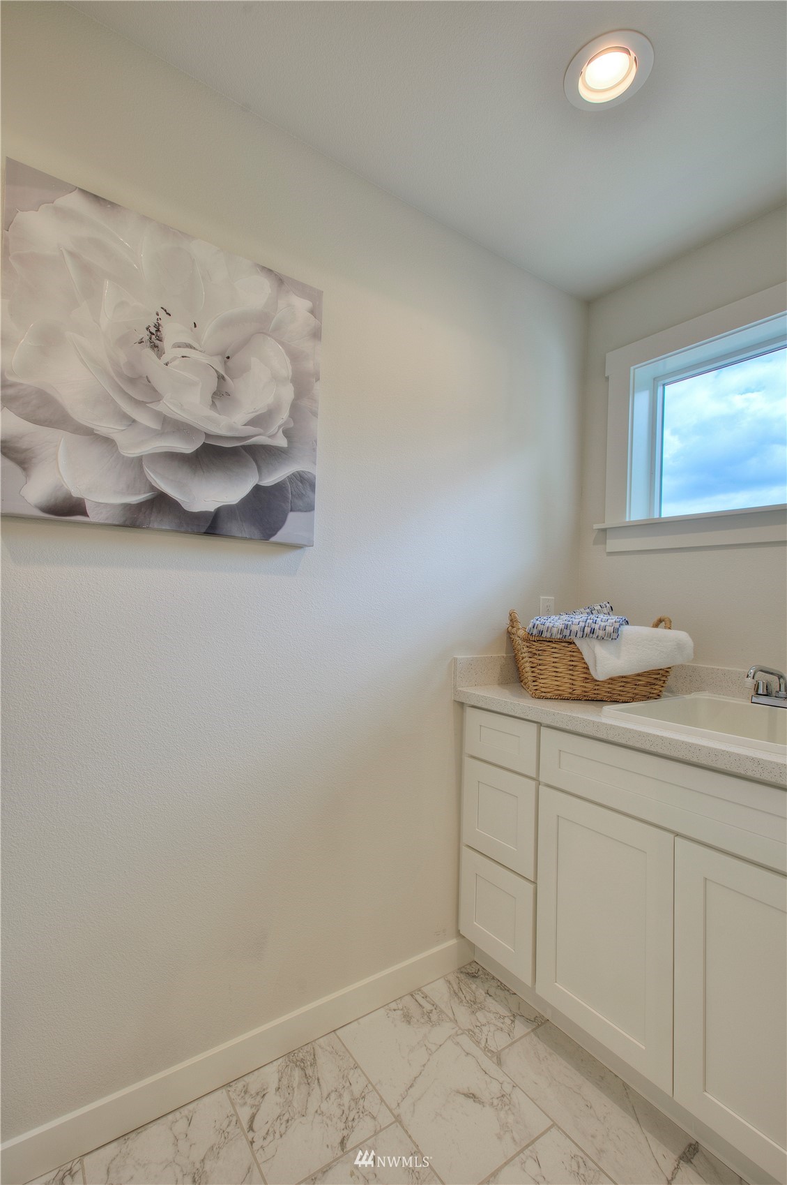 12222 Military Road South Seattle, WA 98168 - Photo 13 of 33 a bathroom with a sink and a mirror