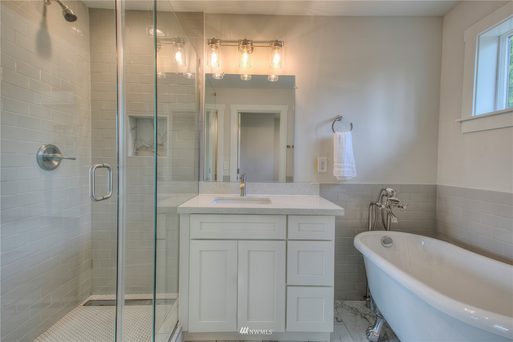 12222 Military Road South Seattle, WA 98168 - Photo 15 of 33 a bathroom with a granite countertop sink a toilet and shower