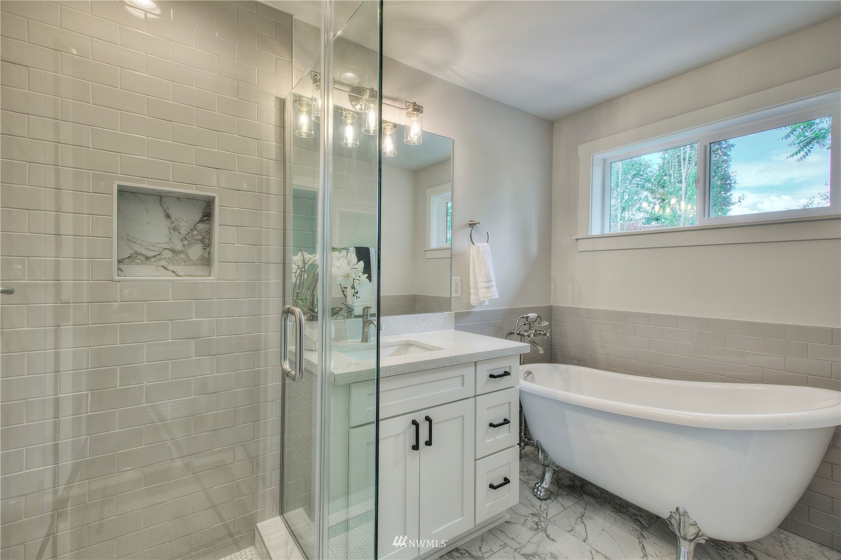 12222 Military Road South Seattle, WA 98168 - Photo 16 of 33 a bathroom with a bathtub sink and toilet