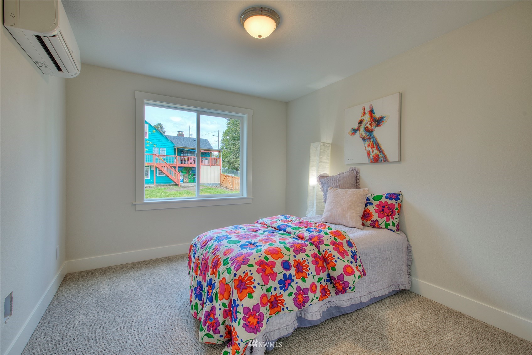 12222 Military Road South Seattle, WA 98168 - Photo 21 of 33 a bedroom with a bed and a window