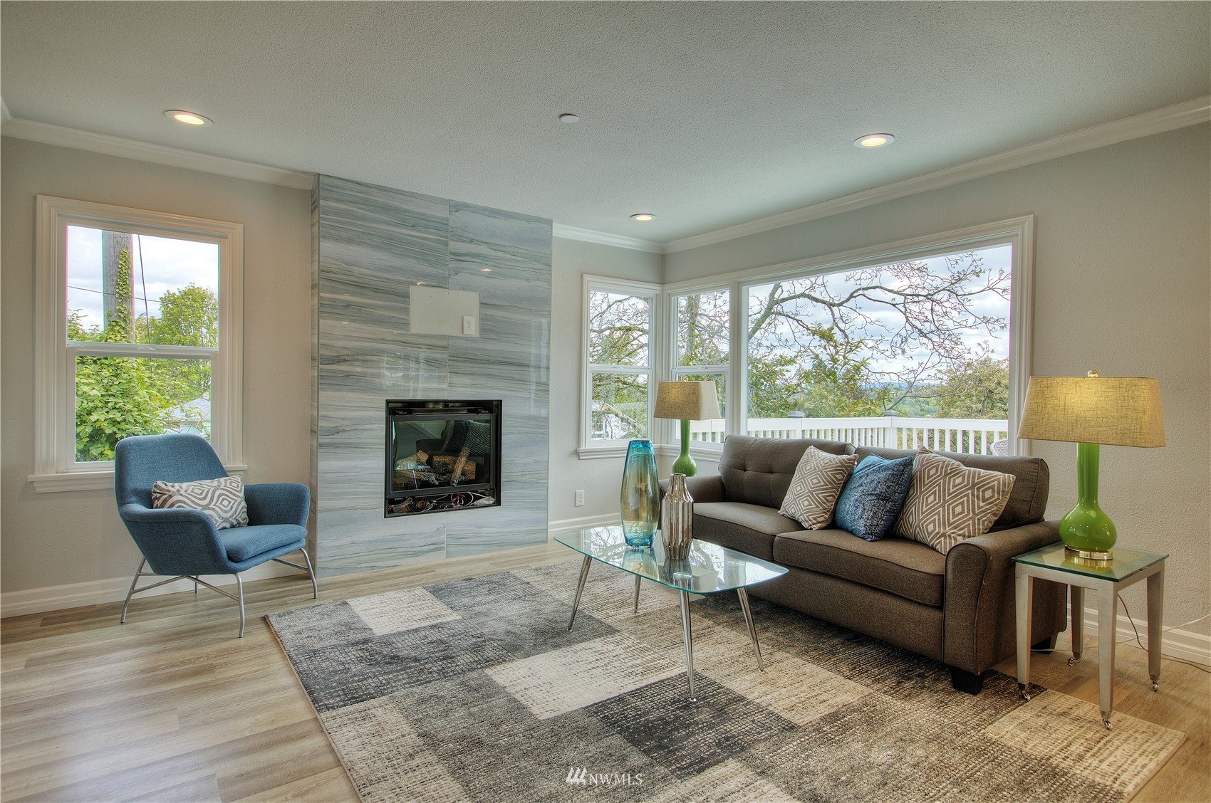 12222 Military Road South Seattle, WA 98168 - Photo 5 of 33 a living room with furniture and a fireplace