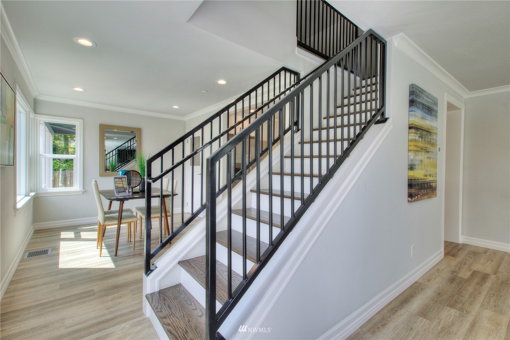 12222 Military Road South Seattle, WA 98168 - Photo 9 of 33 a view of staircase with wooden floor and white walls
