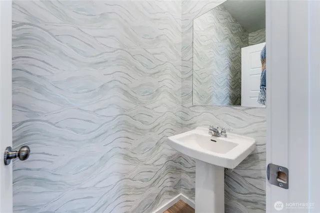 a bathroom with a sink and vanity