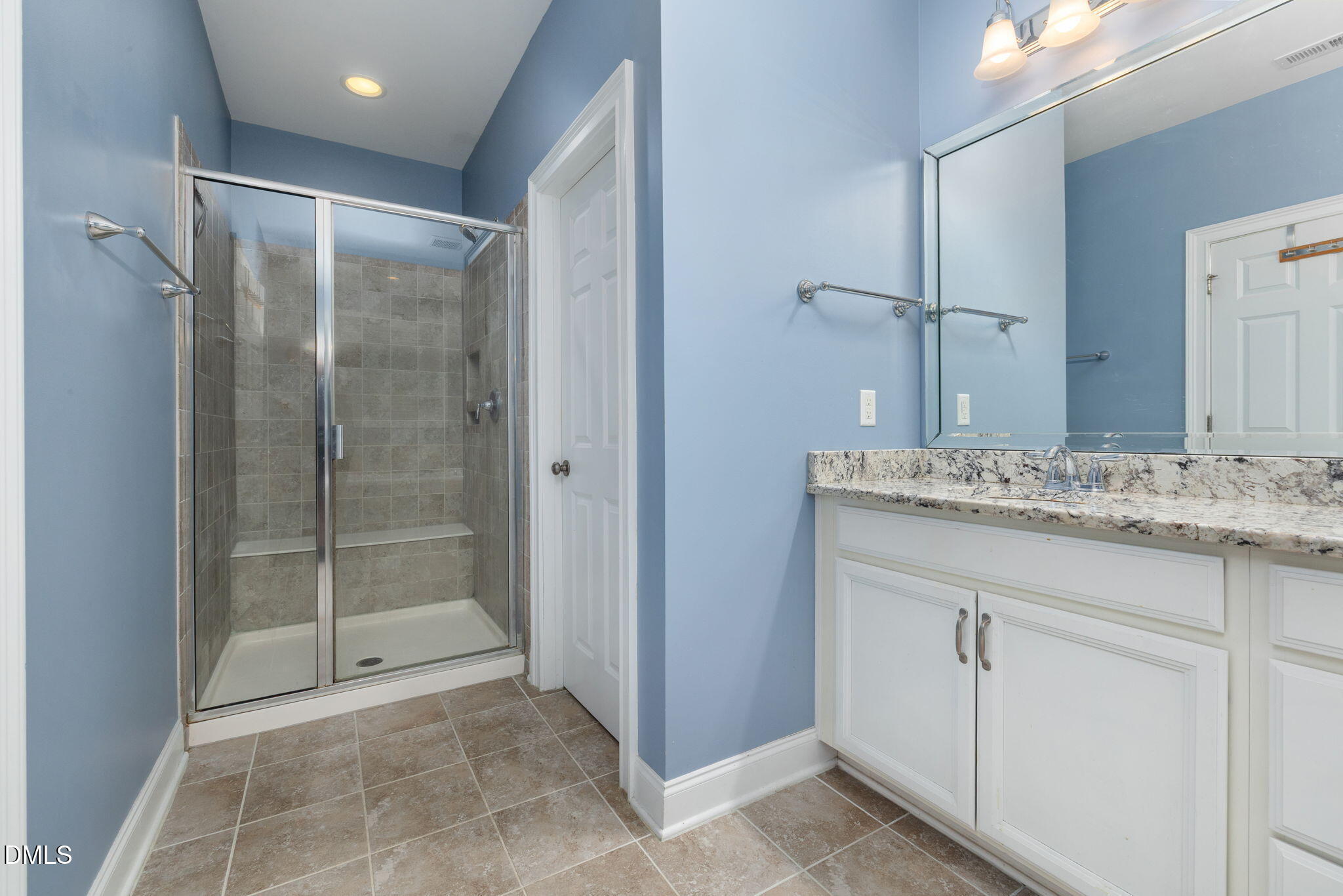 621 Fallon Grove Way Raleigh, NC 27608 - Photo 13 of 24 a bathroom with a granite countertop sink mirror and shower