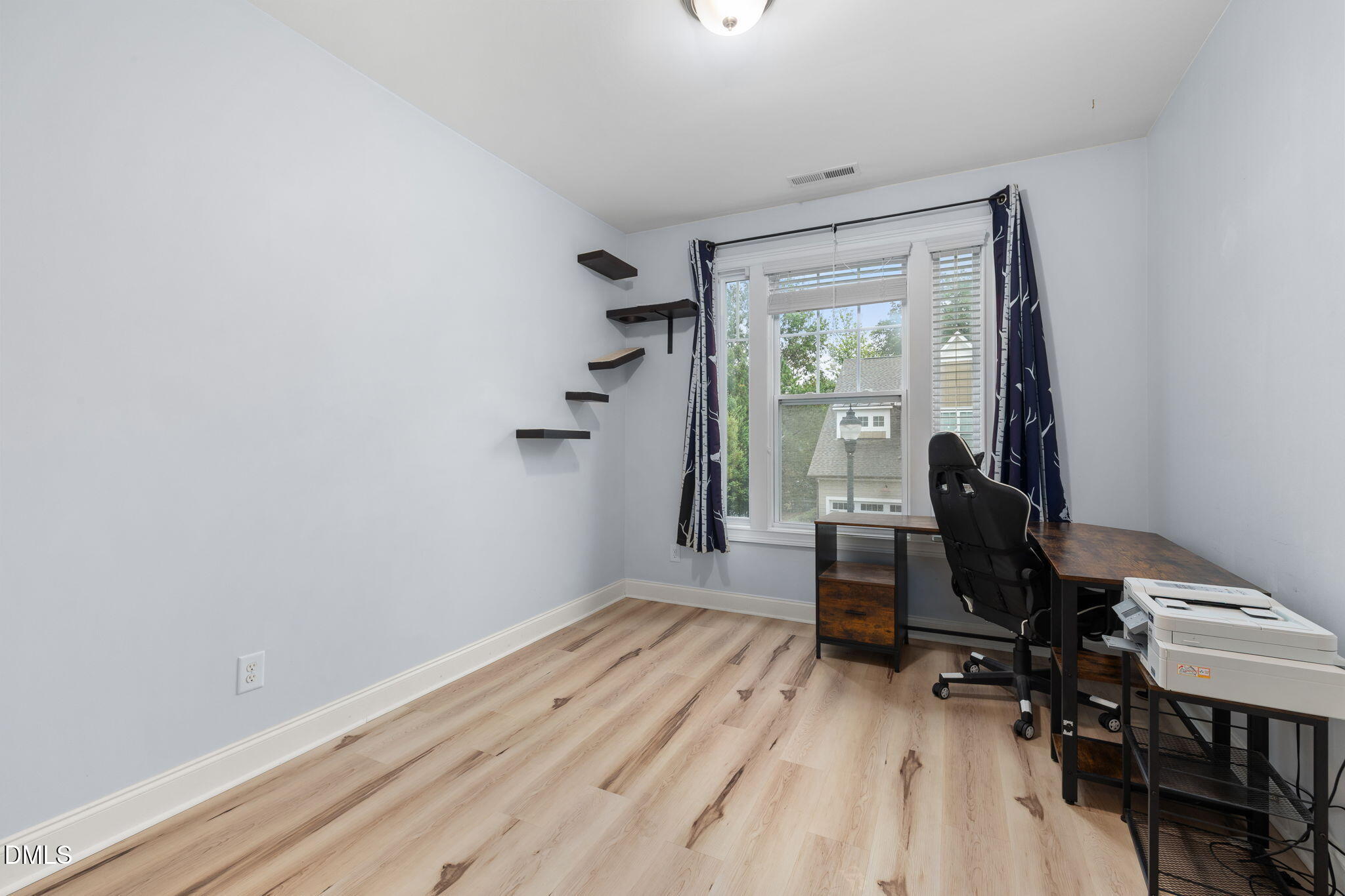 621 Fallon Grove Way Raleigh, NC 27608 - Photo 14 of 24 a view of a workspace with wooden floor and a window
