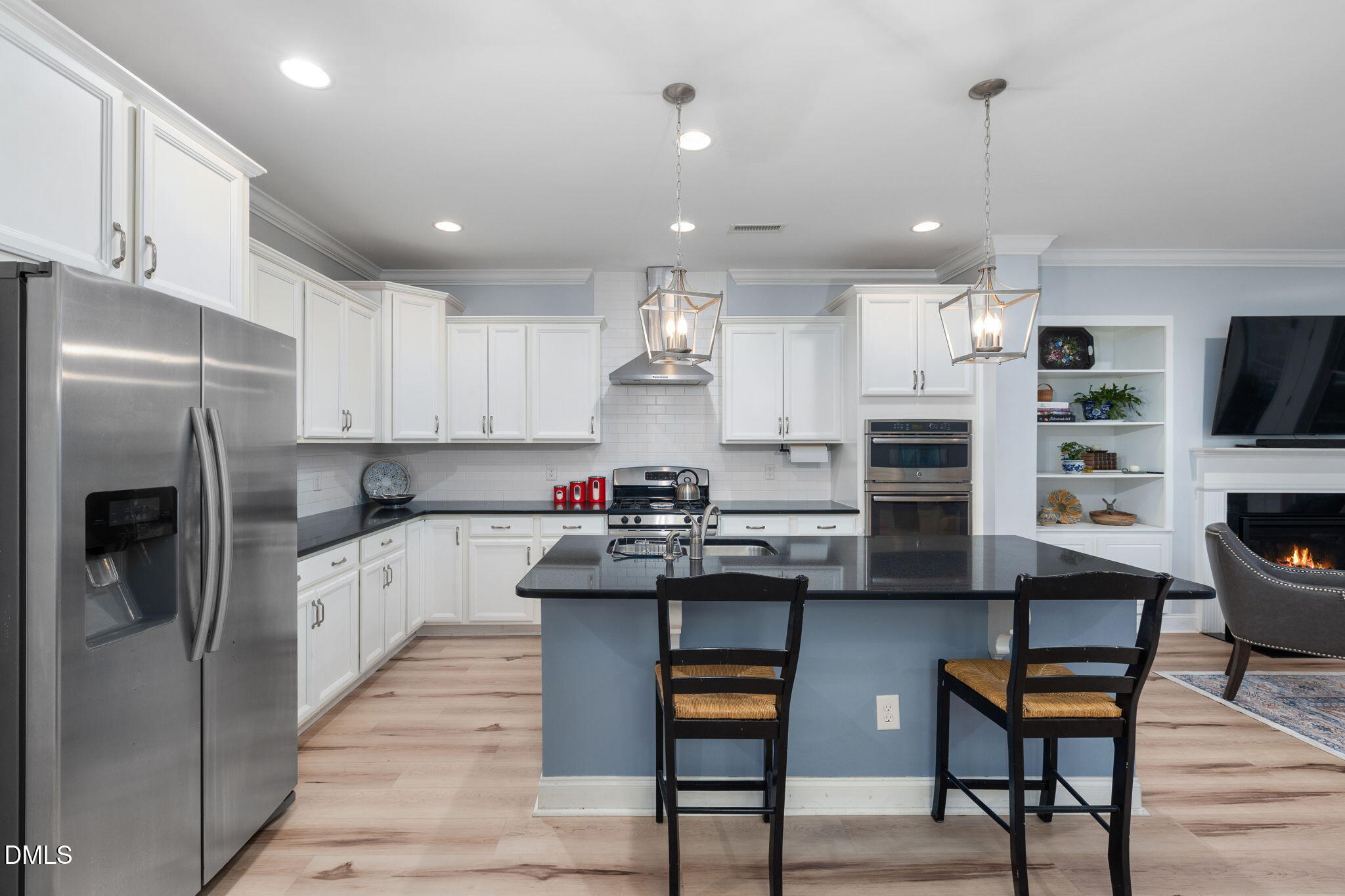 621 Fallon Grove Way Raleigh, NC 27608 - Photo 6 of 24 a kitchen with cabinets and stainless steel appliances