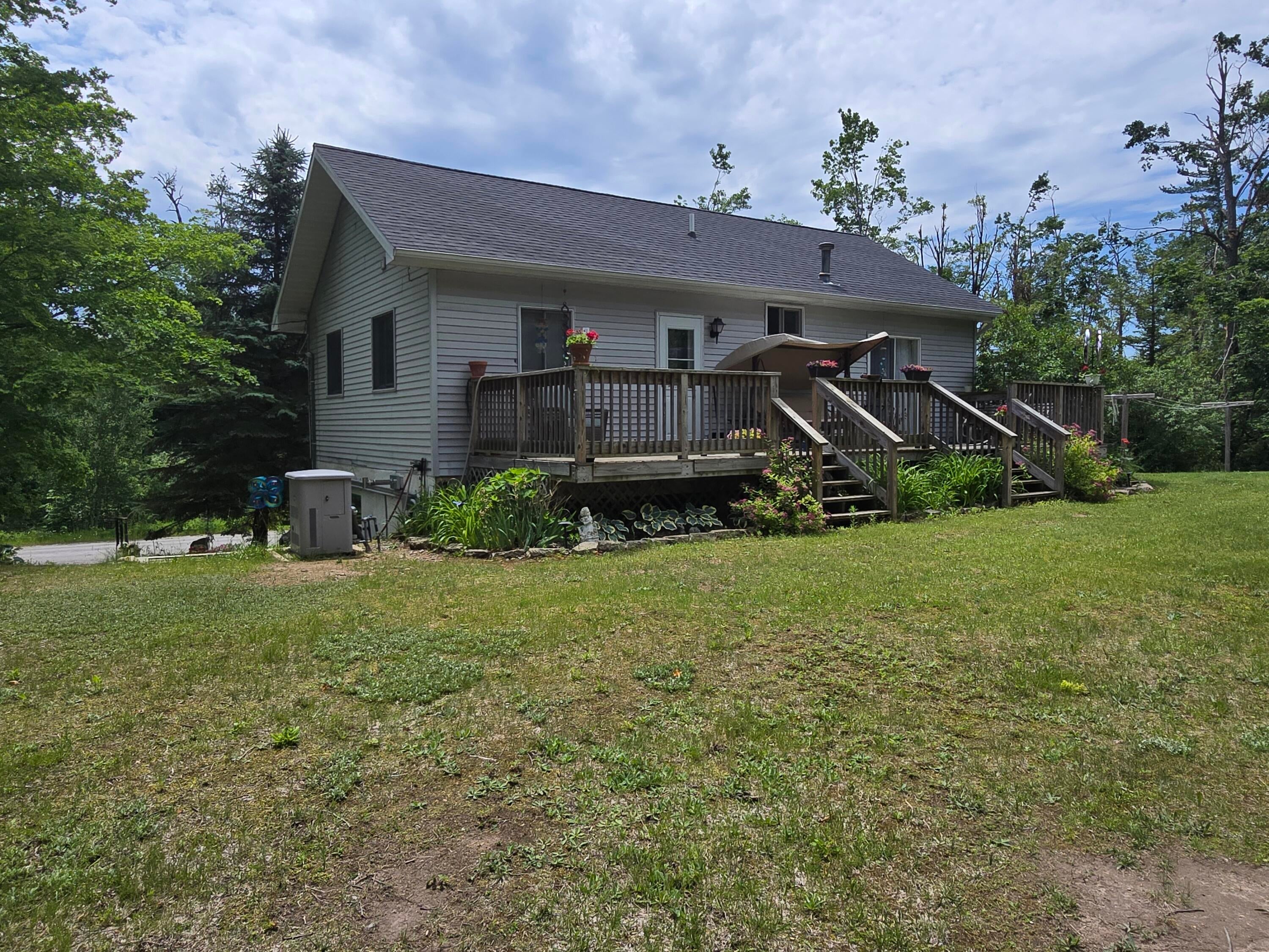 5500 Oley Lake Road Gaylord, MI 49735 - Photo 5 of 44 Back yard summer 2025