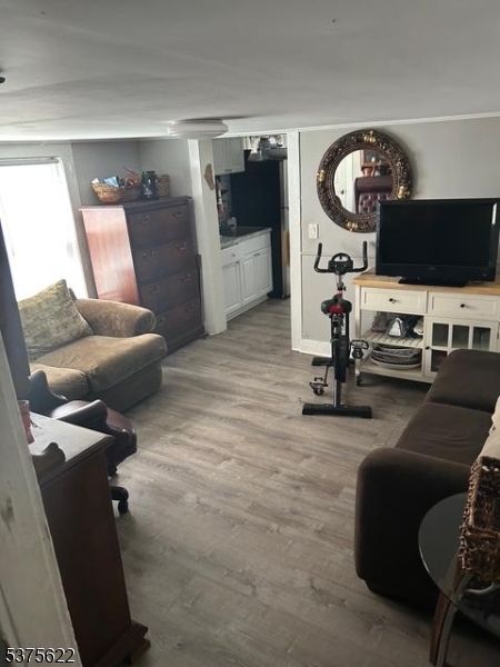 106 West Somerset Street Raritan, NJ 08869 - Photo 11 of 28 a view of a livingroom with furniture and a flat screen tv