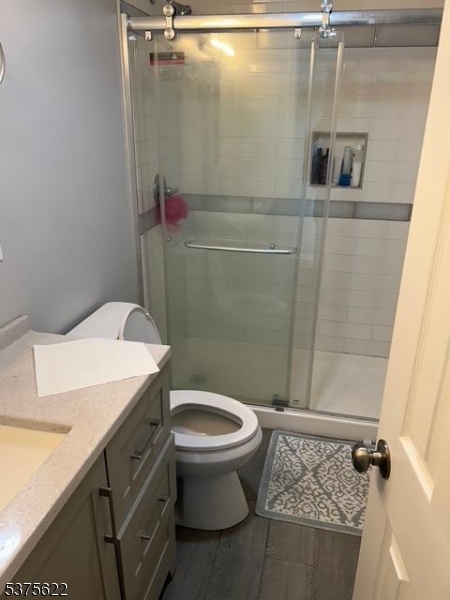106 West Somerset Street Raritan, NJ 08869 - Photo 12 of 28 a bathroom with a granite countertop sink toilet and shower