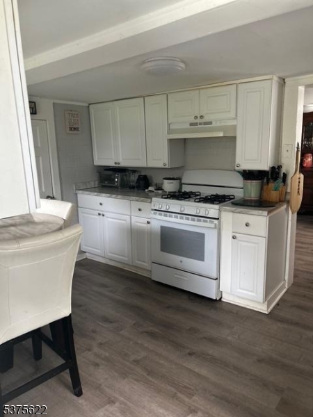 106 West Somerset Street Raritan, NJ 08869 - Photo 16 of 28 a kitchen with stainless steel appliances white cabinets a sink and a stove