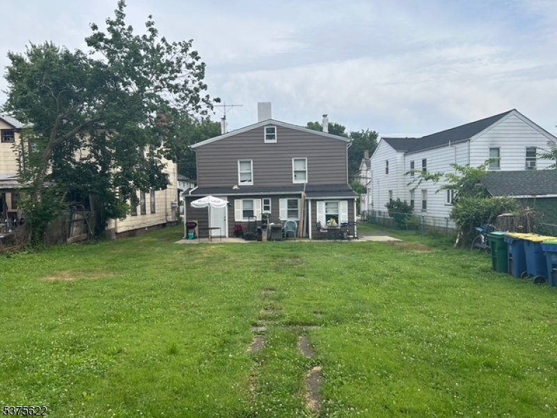 106 West Somerset Street Raritan, NJ 08869 - Photo 23 of 28 a view of a house with a backyard
