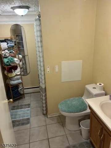 a bathroom with a toilet and a sink