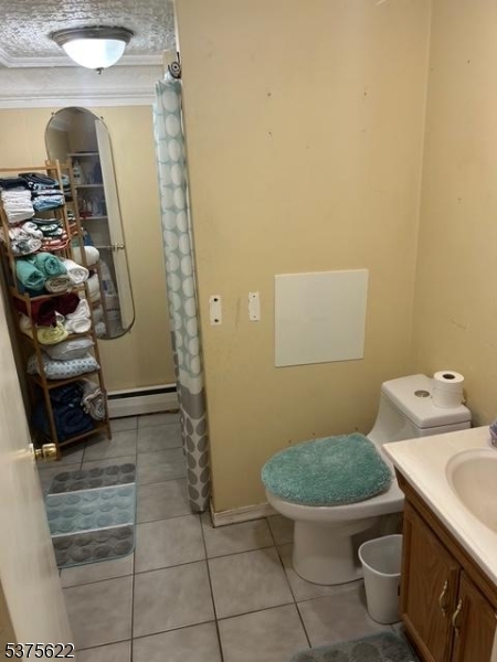 106 West Somerset Street Raritan, NJ 08869 - Photo 7 of 28 a bathroom with a toilet and a sink