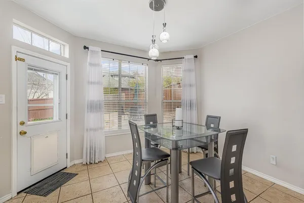 a view of a dining room with furniture window and outside view