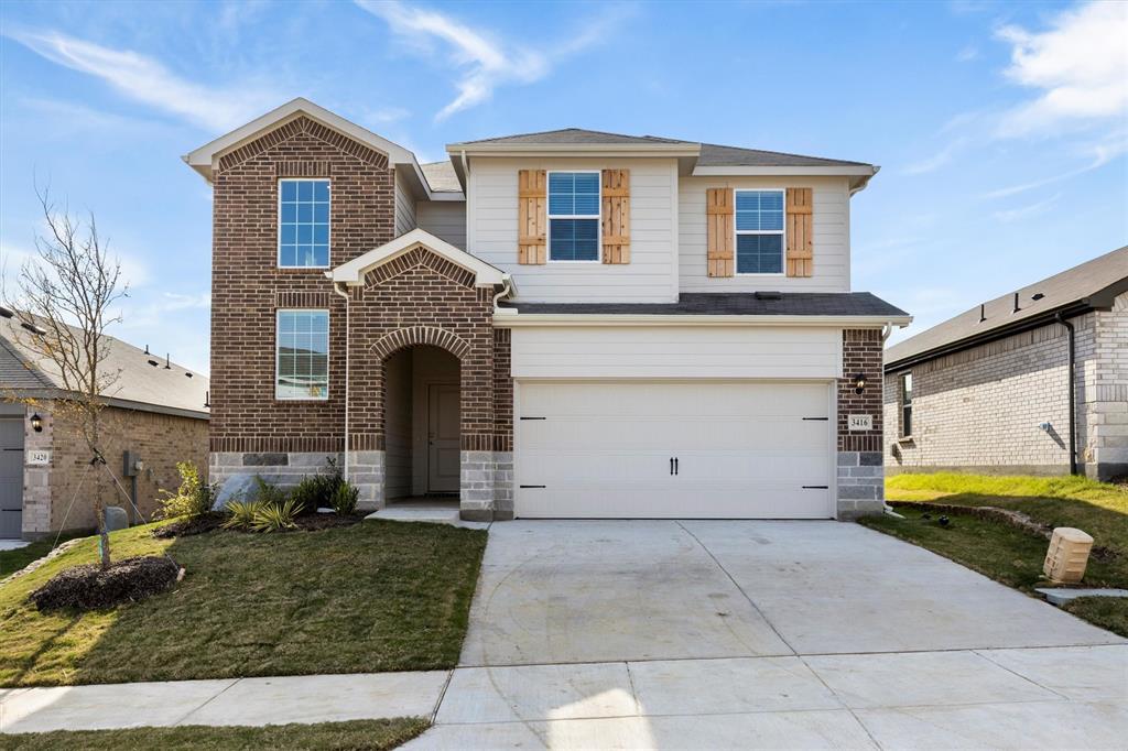 3416 Rendezvous Way Sherman, TX 75090 - Photo 1 of 24 a front view of a house with garden