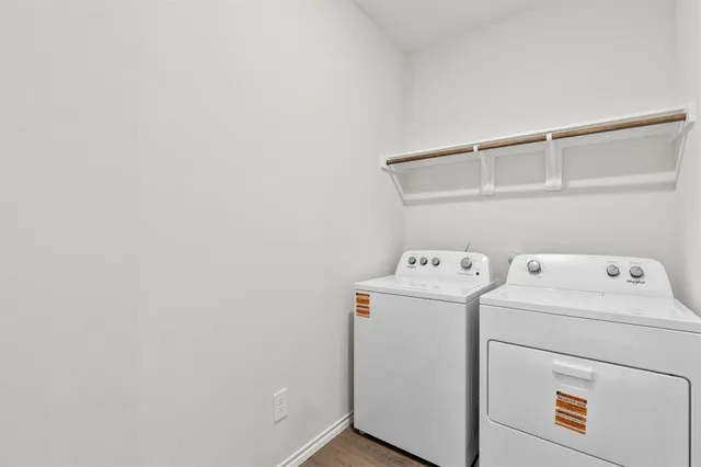 a view of storage and utility room with washer and dryer