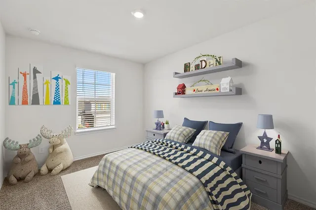 a bedroom with a bed and window