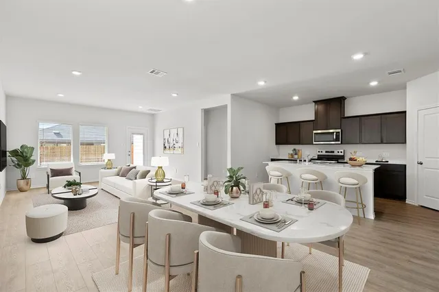 a kitchen with a sink and white cabinets