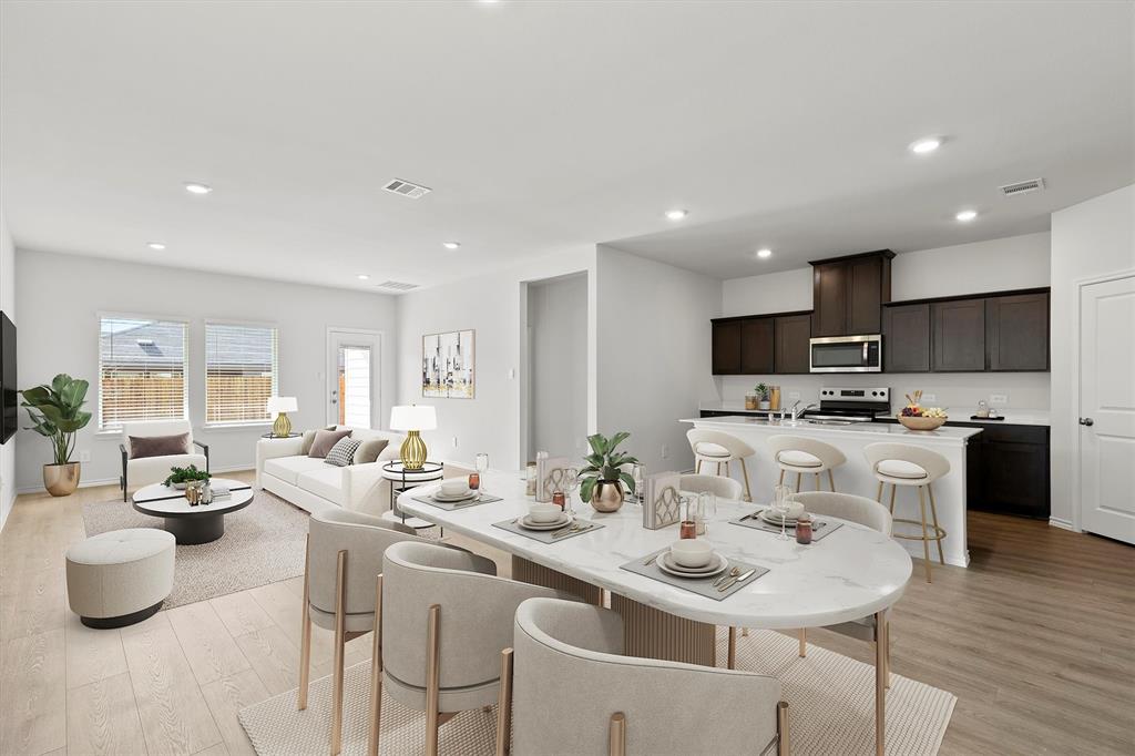 3416 Rendezvous Way Sherman, TX 75090 - Photo 2 of 24 a kitchen with a sink and white cabinets