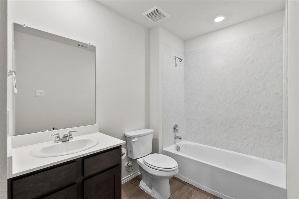 3416 Rendezvous Way Sherman, TX 75090 - Photo 21 of 24 a bathroom with a sink toilet a mirror and shower