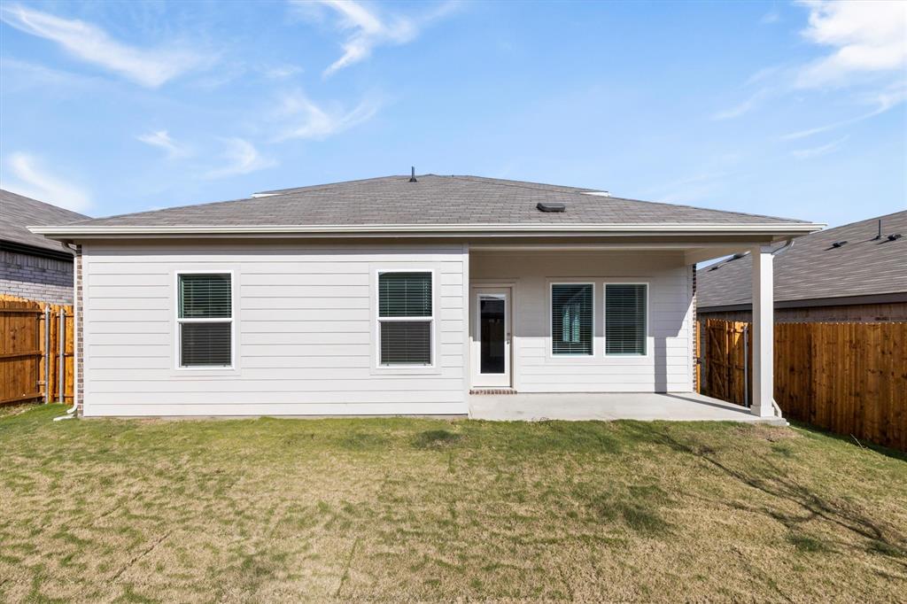 3416 Rendezvous Way Sherman, TX 75090 - Photo 24 of 24 a front view of a house with glass windows and yard