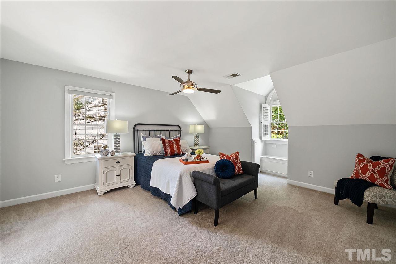 1209 Weldon Place Raleigh, NC 27608 - Photo 14 of 30 a bed room with a bed and a window