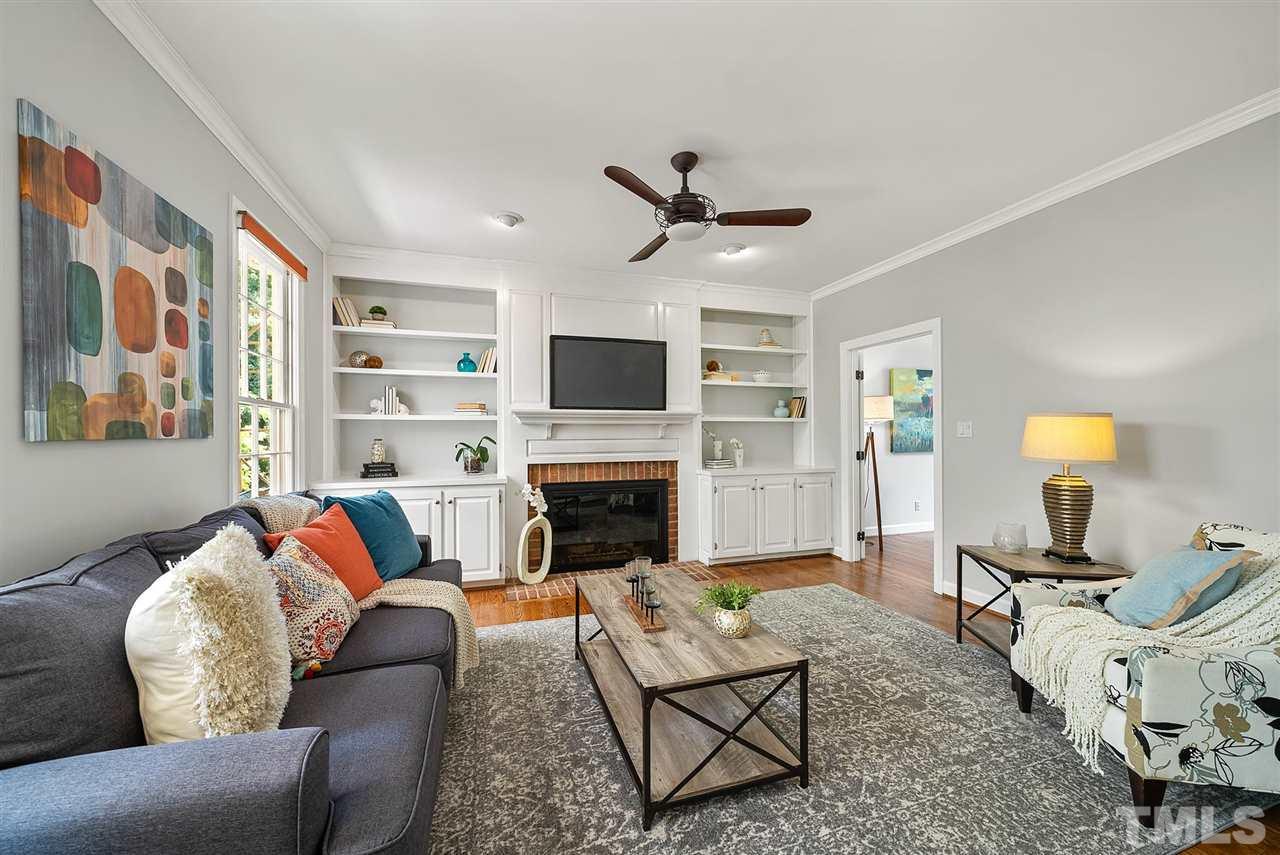 1209 Weldon Place Raleigh, NC 27608 - Photo 4 of 30 a living room with furniture fireplace and a window